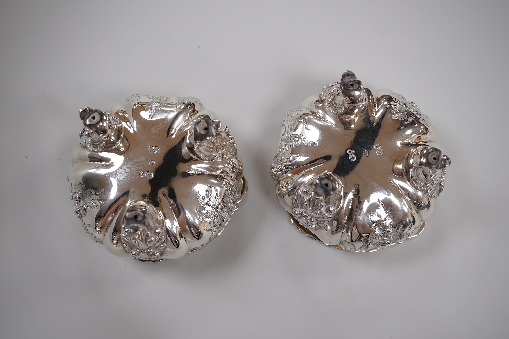 A pair of early Victorian silver cauldron salts, by John Tapley, London, 1838, with later blue glass liners, diameter 94mm, together with a pair of George IV silver Old English pattern condiment spoons, London, 1828.